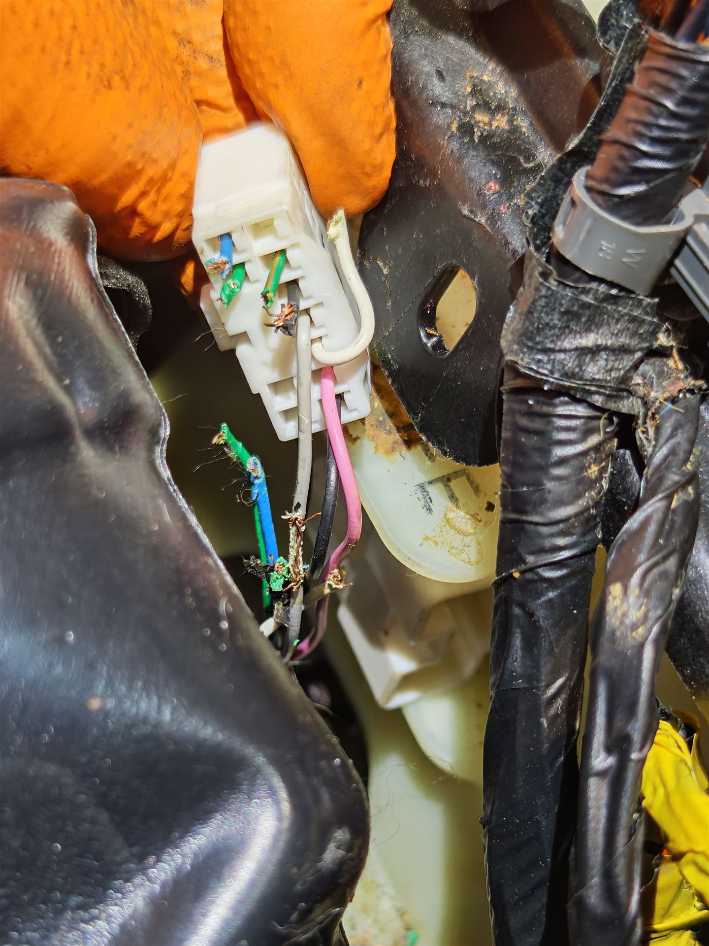 Damaged wiring connector being repaired at Car Avenue workshop in Ashbourne